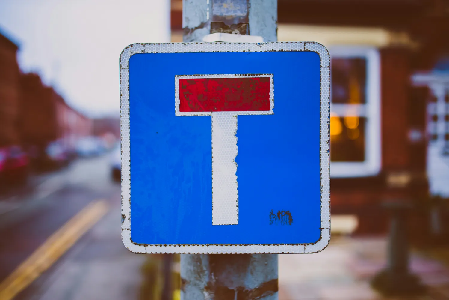 Blue no through road sign on a pole